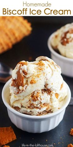 two bowls filled with ice cream on top of a black table next to crackers