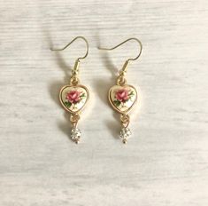 "Vintage inspired Japan Heart Flower Earrings Stones made in Japan. Settings made in USA. S I Z E :: 1\" C O L O R :: matte pink, gold, green Gold Brass finish Lightweight Nickel Free Perfect gift for anyone Please note: Due to the one-of-a-kind nature of the medium, exact color patterns may vary slightly from the image shown. Please visit my shop for listings" Vintage Floral Jewelry, Grandma Earrings, Earrings Stones, Pink Gift Ideas, Cottagecore Earrings, Nature Earrings, Earrings Heart, Heart Flower, Matte Pink