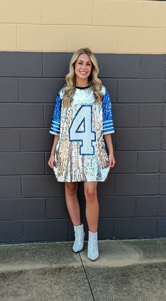 SHIP SAME DAY IF ORDER BY 4 PM. Your Game Day Sparkle will be seen by everyone in this Show Stopping Sequin Jersey No. 4 Mini Dress/Top! Wear over jeans or leggings for a Tunic look, Tucked In with Jeans, Shorts or Skirt or wear it with boots or heels as a Dress! Dress is fully sequined on front. NOTE: This is a One Size Fits Most. As such it will fit and look different on everyone. One Size Regular  Will fit from a Small to Large There is Stretch.  Also depends on Body Type, Body Length and Leg Sequin Jersey, 4 Pm, Dress Top, Dress Clothes For Women, Top Dress, Jeans Shorts, Sequin Dress, Game Day, Body Types