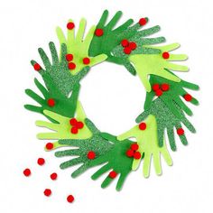 green and red handprinted christmas wreath on white background