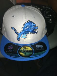 a detroit lions hat sitting on top of a table