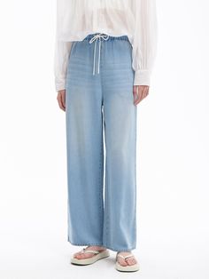 Details: Summer Slouchy Vintage Tencel JeansLoose and straight fitElasticated waistband + drawstring designColour blocked URL embroidered logo Materials & Care: Lycra 90.1 %Cotton 9.9 % Hand wash | Dry clean Do not bleach Size & Fit: Model is 5'7", Bust 32, Waist 24, Hips 35, wearing a size S Item #: IN2DP11 Denim Jean Dress, Chic Business Casual, Shirt Sale, Jeans Dress, Skirts For Sale, Winter Collection, T Shirt Dress, Denim Jeans, Denim Shorts