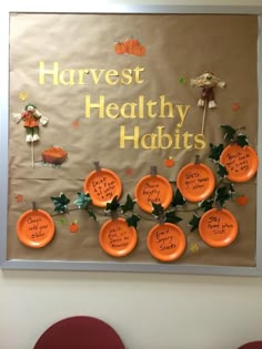 a bulletin board with orange plates and writing on it that says harvest healthy habitts