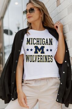 MICHIGAN WOLVERINES TO THE POINT BOXY FIT WOMEN'S CROP TEE White Collegiate T-shirt For College Events, School Spirit Tops With University Logo For Fan Gear, University Logo Tops For School Spirit Fan Gear, University Logo Sports Fan Tops, University Logo Tops For Fan Gear, White Sports Fan College Top, Collegiate Tops With Team Logo For Cheerleading, White Short Sleeve Top With University Logo, White Tops With University Logo For Sports Season