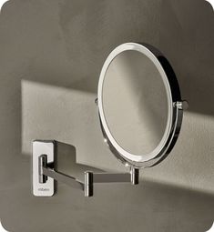 a mirror mounted to the side of a wall