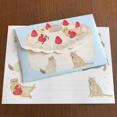 an envelope is decorated with cats and hearts