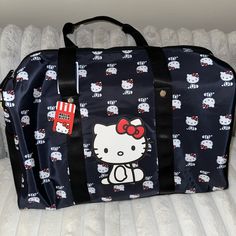 Hello Kitty Overnight/Duffel Bag New With Tags Rectangular Hello Kitty Shoulder Bag For Travel, Hello Kitty Print Travel Shoulder Bag, Travel Rectangular Bag With Hello Kitty Print, Trendy Black Bag With Hello Kitty Print, Black Hello Kitty Print Bag For Daily Use, Black Hello Kitty Print Travel Bag, Black Hello Kitty Travel Bag, Black Hello Kitty School Bag, Black Travel Bag With Cat Design