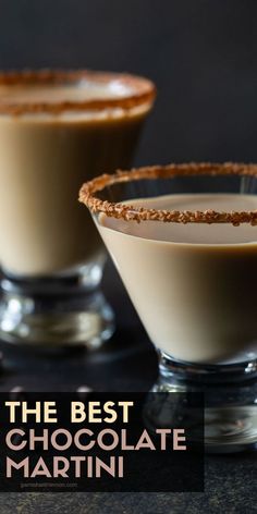 two glasses filled with chocolate martinis sitting on top of a black table next to each other