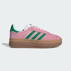 It wouldn't be a list of adidas' most iconic shoes without the Gazelle. First worn on indoor courts in the '70s, the suede shoe is gaining new fans to this day. Now the style you covet is lifted up to new heights. It's stacked three layers high, for a new perspective on the classic style. The details stay sporty with buttery-soft suede and serrated 3-Stripes. A metallic-gold "Gazelle" is the final stamp of our heritage. Adidas Shoes Gazelle, Pink Gazelles, Adidas Rose, Adidas Gazelle Bold, Gazelle Bold, Bold Shoes, Streetwear Essentials, Nike Dunk High, Adidas Campus