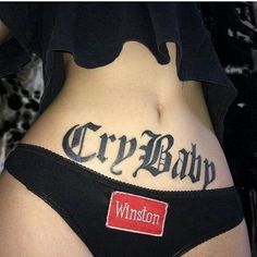 a woman's stomach with the words crybap written on it and a name tag