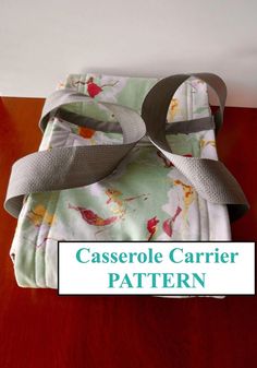 a close up of a piece of cloth on top of a table with the words casserole carrier pattern