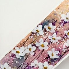 an abstract painting with white flowers on pink and purple wood planks, painted in acrylic paint