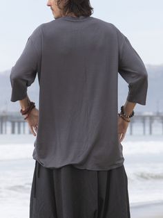 This gray loose mens top is so soft and so comfy that it will be your perfect lounge wear, as well as a great yoga shirt or a meditation top. It has a nice edgy urban look and can be worn in the city as well as a part of a festival outfit. Try it with our glorka harem pants - they go so well together! Materials: stretch cotton jersey. NOTE: If you want black or white color- please message in the notes to seller when purchasing. Fabric for this pair was bought in Fashion District in LA and the pa Oversized Crew Neck Top For Relaxation, Comfortable Solid Color Tops For Relaxation, Comfortable Solid Tops For Yoga, Comfortable Oversized Tops For Relaxation, Gray Yoga Tops For Summer, Gray Yoga Top For Summer, Gray Summer Yoga Top, Gray Summer Tops For Yoga, Casual Gray Top For Relaxation