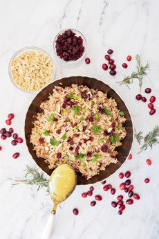 rice and cranberries in a bowl on a table