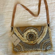 This Bag Is Brand New, Never Used! It’s Had Gorgeous Beading And Embroidery Throughout The Front. It Has A Long Strap That Can Be Adjusted And A Very Spacious Inside With Pockets For Organization. Embellished Tote Shoulder Bag For Everyday Use, Bohemian Embellished Clutch Shoulder Bag, Brown Embellished Shoulder Bag For Everyday Use, Bohemian Embellished Shoulder Bag For Everyday, Summer Embellished Rectangular Shoulder Bag, Bohemian Gold Embellished Bags, Embellished Everyday Pouch Bag, Embellished Pouch Bag For Everyday Use, Embellished Clutch Bags For Everyday Use