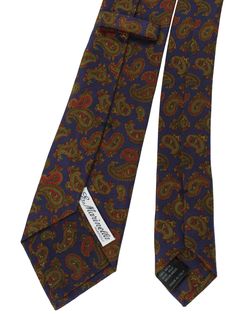 E. Marinella Ties | Wide Neckties E. Marinella New Collection - Genuine E. Marinella tie, classic purple / green / maroon paisley design, fancy silk, hand made in Italy. Color: Purple / Green / Maroon Fabrics: 100% Silk, Self Tipped Size: Width: 3.15"/ 8cm, Regular Length 58" Origin: Hand Made in Italy Brand: E. Marinella Napoli Original E. Marinella Gift Box ( Flat ) Upon Request Genuine / Authentic Product code: mari220874 E. Marinella is a sartorial quality brand from Napoli, Italy. The E. Ma Elegant Multicolor Paisley Print Suit And Tie Accessories, Green Paisley Tie, Classic Paisley Print Patterned Ties, Vintage Brown Scarf With Paisley Print, Elegant Multicolor Paisley Print Ties, Vintage Multicolor Paisley Scarves, Vintage Multicolor Business Ties, Tie Matching, Designer Ties