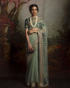 This saree featured in the mint color net fabric. The border of the saree is handcrafted in zardozi work and sequin work butties on all over saree. The blouse is in green color dupion silk with zardozi embroidery. This saree can be customized in any color of your choice. Sabyasachi Sarees, Sabyasachi Lehenga, Sari Design, Red Lehenga, Ghagra Choli, Designer Sarees Online, Green Saree, Net Saree, Saree Trends