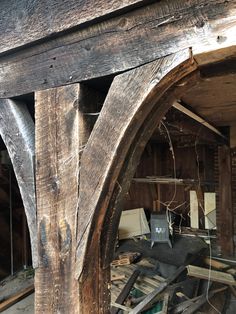 the inside of an old building with wooden beams