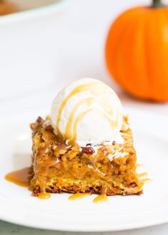 a slice of pumpkin pie with ice cream on top