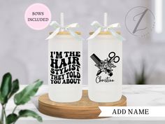 two personalized water bottles with bows on the top, one is for hair stylist