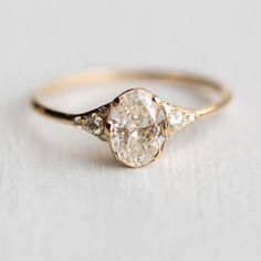 an engagement ring with three diamonds on it