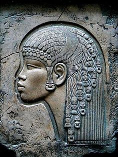 an ancient egyptian relief depicting the head of a woman