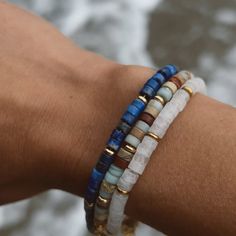 Add a retro layer of color with this natural Lapis Lazul gemstone Bracelet. A nostalgic, handcrafted pattern of genuine stone beads imported from India. MATERIAL HIGHLIGHT: Lapis Lazuli, also known as Blue Lapis is one of the most sought-after genuine stone Its deep, celestial blue remains the symbol of royalty and honor, gods and power, spirit and vision. It is a universal symbol of wisdom and truth. "Lapis Lazuli, resembling the blue of the heavens, was believed to counteract the wiles of the Bracelets With Gemstone And Heishi Beads, Adjustable Lapis Lazuli Gemstone Beaded Bracelets, Bohemian Lapis Lazuli Beaded Bracelets With Natural Stones, Bohemian Beaded Bracelets With Lapis Lazuli Stones, Bohemian Beaded Bracelets With Lapis Lazuli, Adjustable Blue Beaded Earthy Bracelet, Adjustable Earthy Blue Beaded Bracelets, Earthy Blue Bracelets As Gift, Earthy Blue Bracelets For Gifts