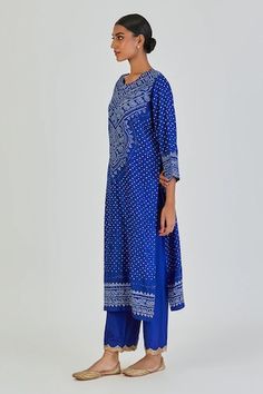 Royal blue three fourth sleeves straight kurta with all over bundi with different patterns of bandhani, dots, chaubundi, leheriya and paisley motifs. Paired with a palazzo with embellished lace embroidered scalloped hem. - Aza Fashions Blue Cutdana Straight Kurta, Blue Straight Kurta Palazzo Set For Diwali, Blue Palazzo Set With Straight Kurta For Diwali, Blue Palazzo Set For Diwali With Straight Kurta, Blue Palazzo Set With Printed Motifs For Navratri, Blue Bandhani Print Palazzo Set For Festive Occasions, Blue Palazzo Set With Printed Motifs And Straight Kurta, Elegant Blue Palazzo Set With Straight Kurta, Festive Blue Bandhani Print Palazzo Set