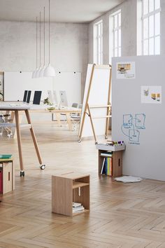 an office with wooden floors and whiteboard on the wall, bookshelf in the foreground