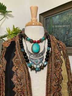 "3, Vintage Tibetan Necklaces, Turquoise, black and Red Necklaces, Layered Necklaces, Curated by Potion Two of these necklace are from the mid 60s and the silver bib is from the 70s. The beads are acrylic, tin, and brass. Designed by me to be worn together or singly for the faint! 17 to 26\" Staff note: 2B in env inv" Black Bohemian Necklace With Natural Stones, Festival Jewelry With Unique Black Variations, Black Bohemian Beaded Necklaces, Bohemian Adjustable Black Turquoise Necklace, Black Bohemian Turquoise Necklace As A Gift, Bohemian Black Turquoise Necklace As Gift, Black Bohemian Turquoise Necklace Gift, Black Bohemian Necklace As Gift, Tibetan Necklace