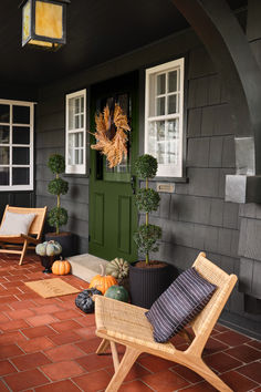 Celebrate the season with simple front porch updates that welcome guests and delight neighbors. Show off your classic style with a dried wreath on your door and black pots filled with evergreen plants. Add pumpkins in various shades and sizes for a festive touch. A jute welcome mat and woven accent chairs with timeless pillows complete the look.

Shop for your home at Birch Lane. Simple Front Porch, Gingham Pillow, Halloween Front Door Decorations, Classic Wreath, Dried Wreath, Halloween Front Doors, Black Planters, Fall Front Porch Decor, Farmhouse Traditional