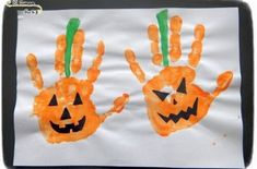 two handprints made to look like pumpkins