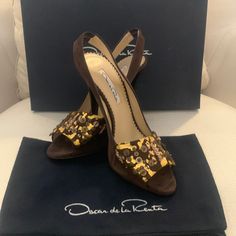 Beautiful Oscar De La Renta Dark Brown Suede With Gold Leaf Amber Slingback Pumps Beautiful And Never Worn. Come With Original Box And Dust Cover. Size 38.5 / 7 Luxury Brown Slingback Pumps For Evening Events, Luxury Brown Slingback Pumps With Buckle Closure, Designer Luxury Brown Slingback Pumps, Suede Slingback Pumps With 4-inch Heel, Gold Strappy Sandals, Plaid Heels, Luxury Brown Slingback Pumps With 4-inch Heel, Black And White Heels, Womens Pumps