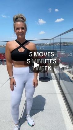 a woman in white pants and sports bra top posing for the camera with her hands on her hips