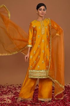 Peachy orange dupion kurta with gota embroidery. Comes with straight pant and an organza dupatta. - Aza Fashions Designer Orange Palazzo Set With Zari Work, Semi-stitched Orange Palazzo Set With Zari Work, Semi-stitched Orange Palazzo Set With Gota Work, Traditional Orange Palazzo Set With Gota Work, Orange Palazzo Set With Resham Embroidery And Traditional Drape, Orange Dori Work Sharara, Orange Palazzo Set With Resham Embroidery, Orange Chanderi Palazzo Set With Gota Work, Orange Resham Embroidered Palazzo Set For Festivals