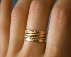 Whimsical 5 band stackers✨ Handmade 14k gold fill soldered bands, which are perfect for everyday wear, and those of you who are minimalistic! Beautiful statement piece, which gives off an etherial and Grecian feel 🦋✨ MATERIAL: 14/20 (karat/purity) gold fill THICKNESS: each band varies from 1- 2.31 mm *will NOT tarnish Each are uniquely hand crafted!💕 Stacked Yellow Gold Wedding Jewelry, Stackable Band Gold Rings, Stackable Gold Band Rings, Thick Gold Ring, Textured Gold Ring, Garnet Ring Silver, Vegan Jewelry, Gold Rings Simple, Hammered Band