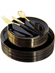 a stack of black and gold plates with forks