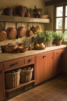 a kitchen filled with lots of pots and pans on top of a wooden shelf