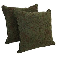 two green and red pillows on white background