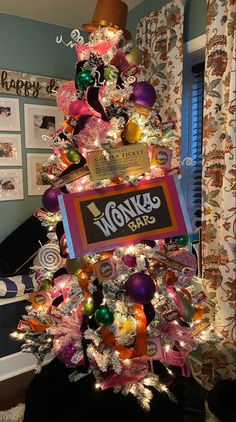 a christmas tree decorated with candy and lollipops