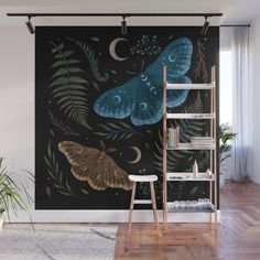 a wall mural with butterflies and leaves on it