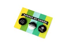 badges of honor are displayed on a card