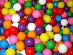 many different colored candies in a pile