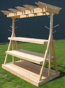 a wooden bench sitting on top of a lush green field