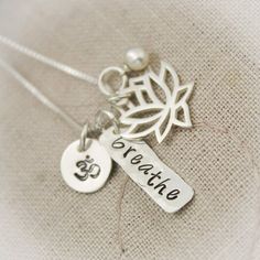 Yoga, Namaste or Breathe Ohm Lotus Flower Necklace with Pearl in Sterling Silver Hand Stamped Jewelry Be peaceful and breathe deep with this necklace. This necklace has several components: Sterling silver ohm charm (can be substituted for an initial) Sterling silver Lotus Flower Yoga Namaste, Lotus Flower Necklace, Cross Necklace Sideways, Necklace With Pearl, Dainty Diamond Necklace, Fine Silver Jewelry, Diamond Solitaire Necklace, Gold Diamond Necklace, Cluster Necklace