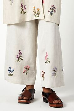 Beige linen pant with multicolour floral embroidered motifs. - Aza Fashions Beige Cotton Pants With Floral Embroidery, Traditional Floral Print Bottoms For Spring, Spring Wide Leg Bottoms With Resham Embroidery, Traditional Spring Floral Print Bottoms, Embroidered Straight Beige Pants, Beige Embroidered Straight Pants, Beige Floral Embroidered Pants, Spring Wide-leg Pants With Floral Embroidery, Beige Floral Embroidery Pants For Summer