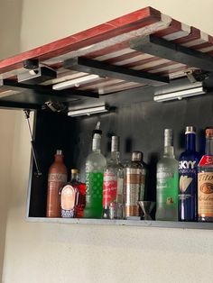 an assortment of alcohol bottles on a shelf