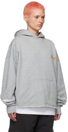 Cotton fleece hoodie. Raw edges throughout. · Logo embroidered at chest · Kangaroo pocket · Rib knit cuffs We recommend sizing up for an oversized fit. Available exclusively at SSENSE. Supplier color: Heather grey Oversized Hoodie With Embroidered Logo For Winter, Oversized Winter Hoodie With Embroidered Logo, Relaxed Fit Hoodie With Embroidered Logo For Streetwear, Oversized Hooded Sweatshirt With Embroidered Logo, Oversized Sporty Hoodie With Embroidered Logo, Sporty Oversized Hoodie With Embroidered Logo, Oversized Crew Hoodie For Winter, Cozy Crew Hoodie For Streetwear, Oversized Crew Neck Winter Hoodie