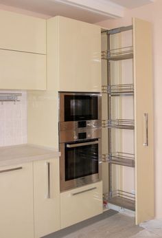 an empty kitchen with two ovens in it