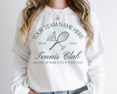 Introducing our Custom Tennis Team Sweatshirt, the perfect blend of style, comfort, and personalization for your team! This high-quality sweatshirt allows you to showcase your team spirit with a unique design that can be fully customized. At the top, proudly display your team name, making it clear who you represent. In the center, mark the year to commemorate your season or special event. At the bottom, add your custom phrase to inspire, motivate, or simply bring a smile to your teammates' faces